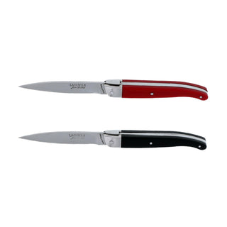 Laguiole steak knives. Slim white Corian handles with shiny